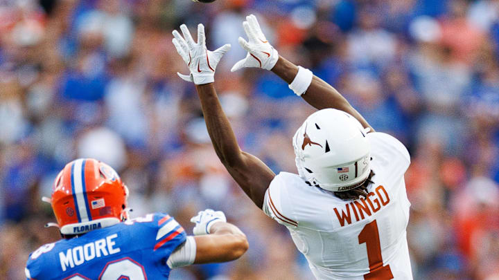 Oct 4, 2025; Gainesville, Florida, USA; Texas Longhorns wide receiver Ryan Wingo (1) attempts a catch over Florida Gators defensive back Devin Moore (28) during the second half at Ben Hill Griffin Stadium. Mandatory Credit: Matt Pendleton-Imagn Images Oct 4, 2025; Gainesville, Florida, USA; Texas Longhorns wide receiver Ryan Wingo (1) attempts a catch over Florida Gators defensive back Devin Moore (28) during the second half at Ben Hill Griffin Stadium. Mandatory Credit: Matt Pendleton-Imagn Images