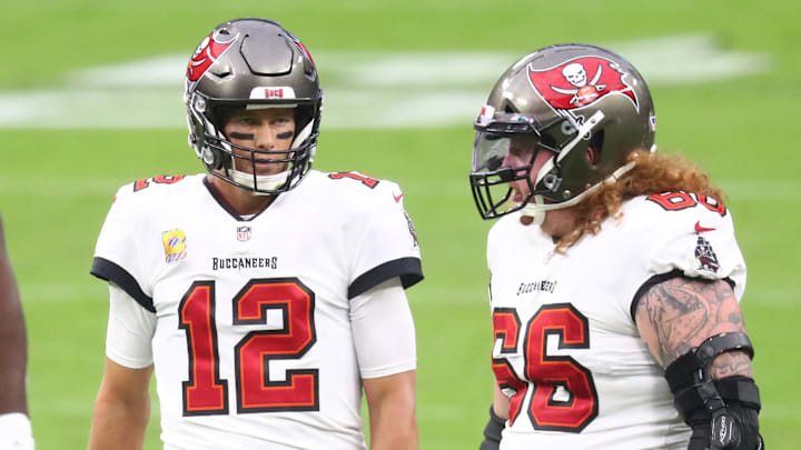 Tampa Bay Buccaneers center Ryan Jensen (66) and quarterback Tom Brady.