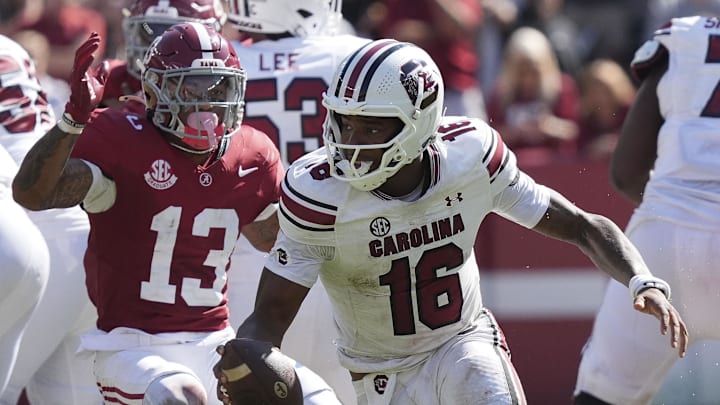 Oct 12, 2024; Tuscaloosa, Alabama, USA; South Carolina Gamecocks quarterback LaNorris Sellers (16) peels away from pressure by Alabama Crimson Tide defensive back Malachi Moore (13) at Bryant-Denny Stadium. Alabama defeated South Carolina 27-25. Mandatory Credit: Gary Cosby Jr.-Imagn Images Oct 12, 2024; Tuscaloosa, Alabama, USA; South Carolina Gamecocks quarterback LaNorris Sellers (16) peels away from pressure by Alabama Crimson Tide defensive back Malachi Moore (13) at Bryant-Denny Stadium. Alabama defeated South Carolina 27-25. Mandatory Credit: Gary Cosby Jr.-Imagn Images