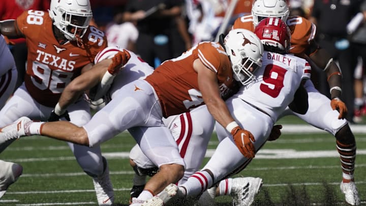 Sep 4, 2021; Austin, Texas, USA; Texas Longhorns linebacker Luke Brockermeyer (47) tackles Louisiana Ragin' Cajuns running back Emani Bailey (9) in the first half at Darrell K Royal-Texas Memorial Stadium. Mandatory Credit: Scott Wachter-Imagn Images Sep 4, 2021; Austin, Texas, USA; Texas Longhorns linebacker Luke Brockermeyer (47) tackles Louisiana Ragin' Cajuns running back Emani Bailey (9) in the first half at Darrell K Royal-Texas Memorial Stadium. Mandatory Credit: Scott Wachter-Imagn Images
