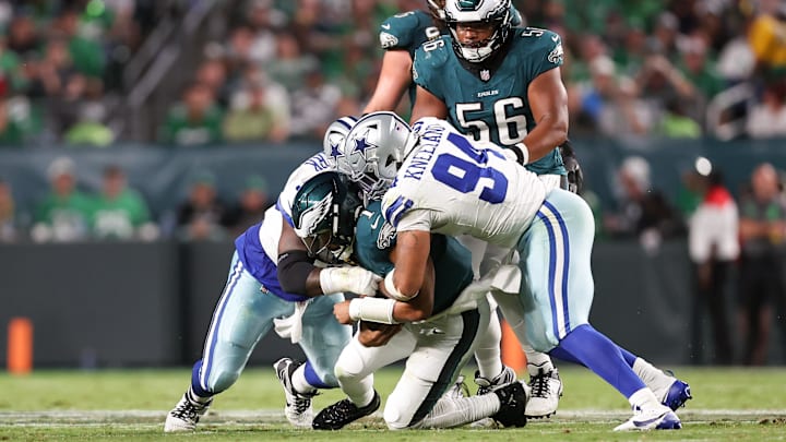 Dallas Cowboys defensive end Marshawn Kneeland sacks Philadelphia Eagles quarterback Jalen Hurts.