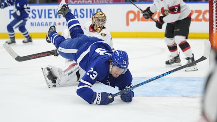 Dec 27, 2025; Toronto, Ontario, CAN; Toronto Maple Leafs forward Matthew Knies (23) falls to the ice after scoring on Ottawa Senators goaltender Leevi Merilainen (1) during the third period at Scotiabank Arena. Mandatory Credit: John E. Sokolowski-Imagn Images Dec 27, 2025; Toronto, Ontario, CAN; Toronto Maple Leafs forward Matthew Knies (23) falls to the ice after scoring on Ottawa Senators goaltender Leevi Merilainen (1) during the third period at Scotiabank Arena. Mandatory Credit: John E. Sokolowski-Imagn Images