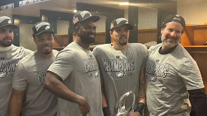 Eagles linebackers - left to right: Ben Van Sumeren, Jeremiah Trotter, Jr., Oren Burks, Zack Baun, and position coach Bobby King - pose with the NFC trophy after beating the Washington Commanders in the conference title game. Eagles linebackers - left to right: Ben Van Sumeren, Jeremiah Trotter, Jr., Oren Burks, Zack Baun, and position coach Bobby King - pose with the NFC trophy after beating the Washington Commanders in the conference title game.