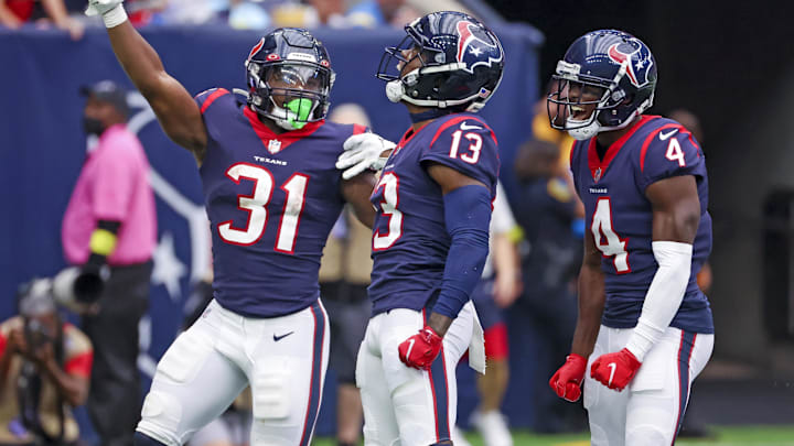 Former Houston Texans wide receiver Brandin Cooks (13) celebrates with wide receiver Phillip Dorsett (4) and Houston Texans running back Dameon Pierce (31) after scoring a touchdown at NRG Stadium. 