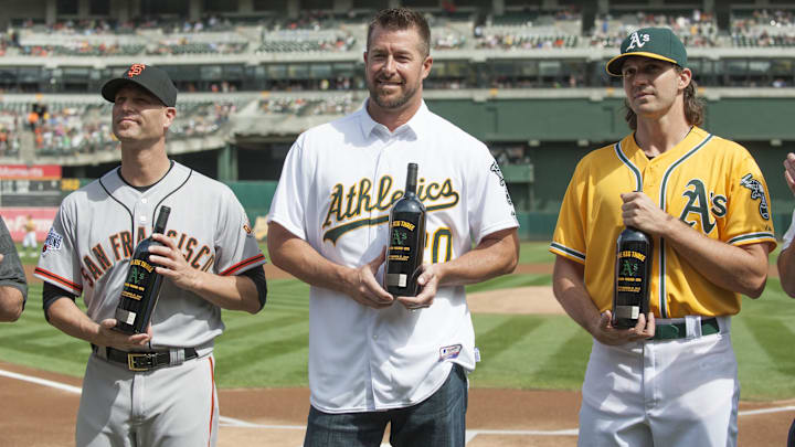 Sep 27, 2015; Oakland, CA, USA; San Francisco Giants starting pitcher Tim Hudson (17) and Oakland Athletics former starting pitcher Mark Mulder and Athletics starting pitcher Barry Zito (75) accept gifts from the Oakland Athletics before the game at O.co Coliseum. Mandatory Credit: Ed Szczepanski-Imagn Images Sep 27, 2015; Oakland, CA, USA; San Francisco Giants starting pitcher Tim Hudson (17) and Oakland Athletics former starting pitcher Mark Mulder and Athletics starting pitcher Barry Zito (75) accept gifts from the Oakland Athletics before the game at O.co Coliseum. Mandatory Credit: Ed Szczepanski-Imagn Images