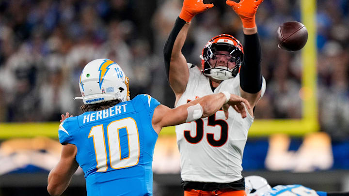Cincinnati Bengals linebacker Logan Wilson (55) rushes Los Angeles Chargers quarterback Justin Herbert (10) as he throws a pass in the third quarter of the NFL Week 11 game between the Los Angeles Chargers and the Cincinnati Bengals at SoFi Stadium in Inglewood, Calif., on Sunday, Nov. 17, 2024. The Chargers won 34-27. Cincinnati Bengals linebacker Logan Wilson (55) rushes Los Angeles Chargers quarterback Justin Herbert (10) as he throws a pass in the third quarter of the NFL Week 11 game between the Los Angeles Chargers and the Cincinnati Bengals at SoFi Stadium in Inglewood, Calif., on Sunday, Nov. 17, 2024. The Chargers won 34-27.
