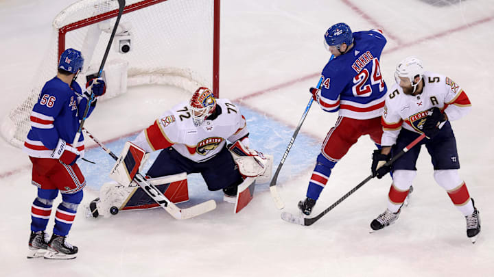 May 30, 2024; New York, New York, USA; Florida Panthers goaltender Sergei Bobrovsky (72) makes a save in front of New York Rangers defenseman Erik Gustafsson (56) and right wing Kaapo Kakko (24) during the third period of game five of the Eastern Conference Final of the 2024 Stanley Cup Playoffs at Madison Square Garden. Mandatory Credit: Brad Penner-USA TODAY Sports