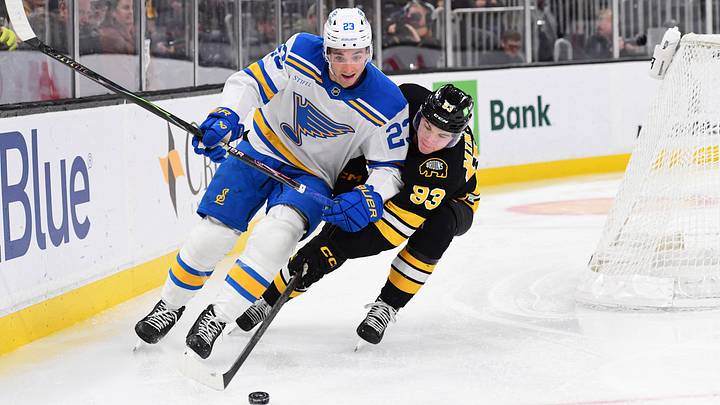 Dec 4, 2025; Boston, Massachusetts, USA; St. Louis Blues defenseman Logan Mailloux (23) and Boston Bruins center Fraser Minten (93) battle for the puck during the third period at TD Garden. Mandatory Credit: Bob DeChiara-Imagn Images Dec 4, 2025; Boston, Massachusetts, USA; St. Louis Blues defenseman Logan Mailloux (23) and Boston Bruins center Fraser Minten (93) battle for the puck during the third period at TD Garden. Mandatory Credit: Bob DeChiara-Imagn Images