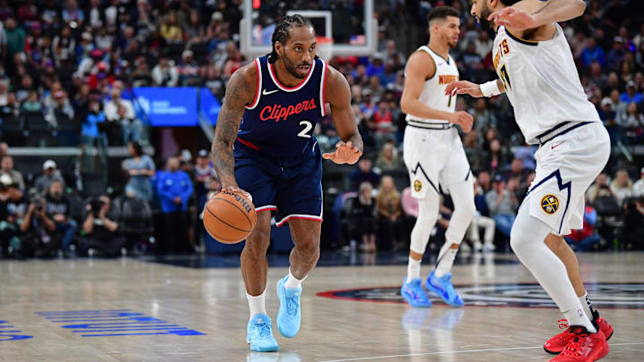 Los Angeles Clippers forward Kawhi Leonard (2) moves the ball against Denver Nuggets guard Jamal Murray (27) 