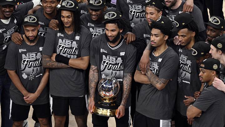 May 30, 2026; Oklahoma City, Oklahoma, USA; San Antonio Spurs forward Julian Champagnie (30) and teammates celebrate with the Oscar Robertson trophy after defeating the Oklahoma City Thunder in game seven of the western conference finals for the 2026 NBA playoffs at Paycom Center. Mandatory Credit: Jerome Miron-Imagn Images May 30, 2026; Oklahoma City, Oklahoma, USA; San Antonio Spurs forward Julian Champagnie (30) and teammates celebrate with the Oscar Robertson trophy after defeating the Oklahoma City Thunder in game seven of the western conference finals for the 2026 NBA playoffs at Paycom Center. Mandatory Credit: Jerome Miron-Imagn Images