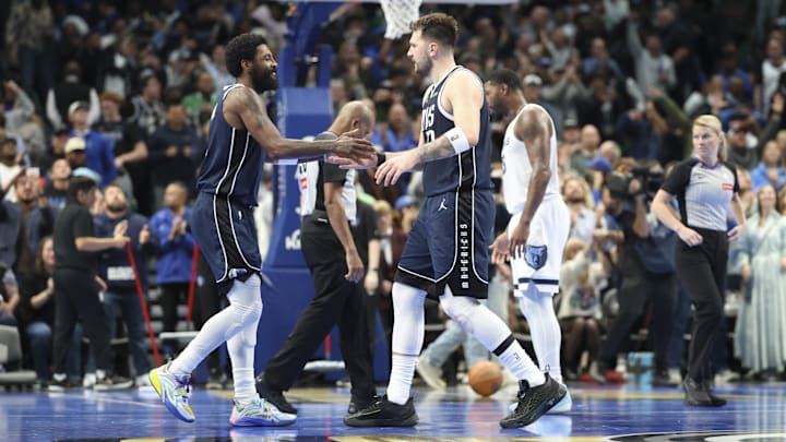 Dec 3, 2024; Dallas, Texas, USA: Dallas Mavericks guard Kyrie Irving (11) celebrates with Dallas Mavericks guard Luka Doncic (77) during the fourth quarter against the Memphis Grizzlies at American Airlines Center. Mandatory Credit: Kevin Jairaj-Imagn Images