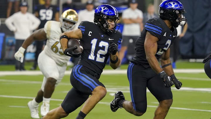 Oct 8, 2022; Paradise, Nevada, USA; Brigham Young Cougars wide receiver Puka Nacua (12) runs the ball against the Notre Dame Fighting Irish during the second half at Allegiant Stadium. Mandatory Credit: Lucas Peltier-Imagn Images