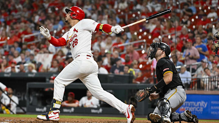 Sep 18, 2024; St. Louis, Missouri, USA;  St. Louis Cardinals third baseman Nolan Arenado (28) hits a one run single against the Pittsburgh Pirates during the third inning at Busch Stadium. Mandatory Credit: Jeff Curry-Imagn Images