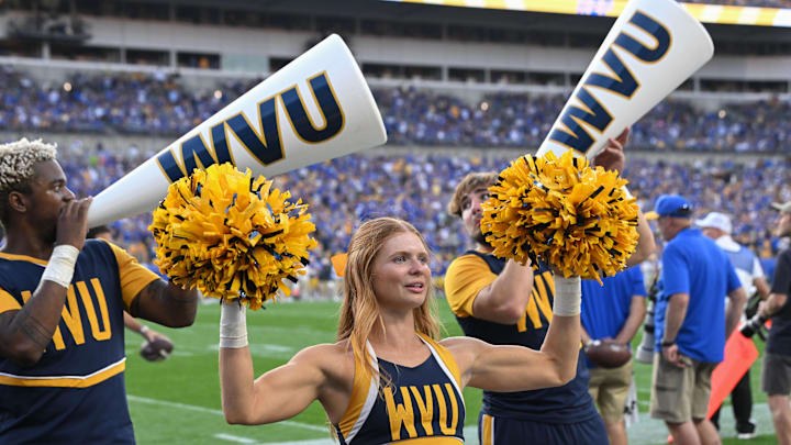 Sep 14, 2024; Pittsburgh, Pennsylvania, USA; West Virginia Mountaineers cheerleaders perform during the fourth quarter against the Pittsburgh Panthers at Acrisure Stadium. Mandatory Credit: Barry Reeger-Image Images Sep 14, 2024; Pittsburgh, Pennsylvania, USA; West Virginia Mountaineers cheerleaders perform during the fourth quarter against the Pittsburgh Panthers at Acrisure Stadium. Mandatory Credit: Barry Reeger-Image Images