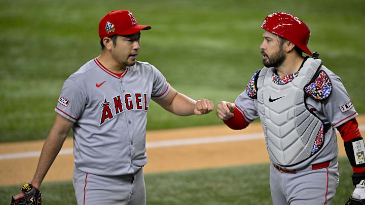 Apr 15, 2025; Arlington, Texas, USA; Los Angeles Angels starting pitcher Yusei Kikuchi (left) and Los Angeles Angels catcher Travis d'Arnaud (right) come off the field during the fifth inning against the Texas Rangers at Globe Life Field. All MLB players will be wearing the number 42 on Jackie Robinson Day to commemorate Robinson making his major league debut in 1947. Mandatory Credit: Jerome Miron-Imagn Images Apr 15, 2025; Arlington, Texas, USA; Los Angeles Angels starting pitcher Yusei Kikuchi (left) and Los Angeles Angels catcher Travis d'Arnaud (right) come off the field during the fifth inning against the Texas Rangers at Globe Life Field. All MLB players will be wearing the number 42 on Jackie Robinson Day to commemorate Robinson making his major league debut in 1947. Mandatory Credit: Jerome Miron-Imagn Images