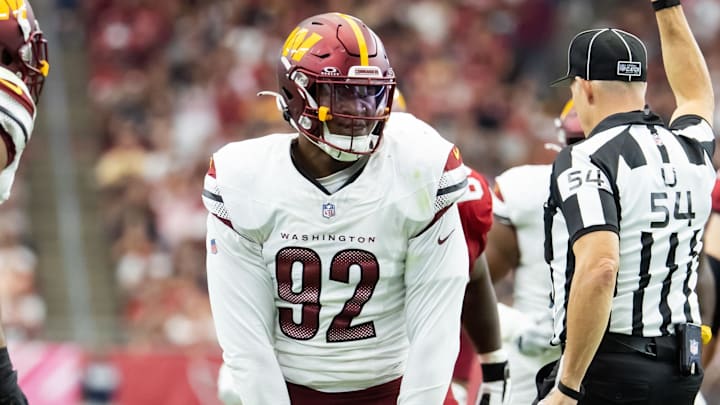 Sep 29, 2024; Glendale, Arizona, USA; Washington Commanders defensive end Dorance Armstrong (92) celebrates after sacking Arizona Cardinals quarterback Kyler Murray (1) in the first half at State Farm Stadium. Mandatory Credit: Mark J. Rebilas-Imagn Images
