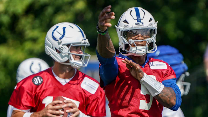 Indianapolis Colts players Daniel Jones (17) and Anthony Richardson Sr. (5) throw passes during the Colts training camp at Grand Park on Saturday, July 26, 2025, in Westfield, Ind.