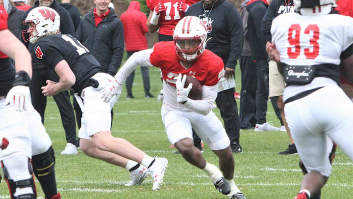 Wisconsin running back Nate White carries the ball during the team's 10th spring practice, which was held on a practice field north of Camp Randall Stadium in Madison, Wisconsin on Saturday April 20, 2024. Wisconsin running back Nate White carries the ball during the team's 10th spring practice, which was held on a practice field north of Camp Randall Stadium in Madison, Wisconsin on Saturday April 20, 2024.