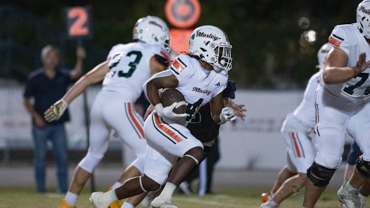 Samuel Chisolm (4) takes it to the house for a touchdown and a 7-0 lead during the Mosley vs Gulf Breeze football game at Gulf Breeze High School on Thursday, Oct. 24, 2024.
