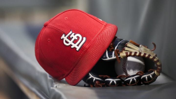 Sep 17, 2018; Atlanta, GA, USA; Detailed view of a St. Louis Cardinals hat and glove in the dugout against the Atlanta Braves in the first inning at SunTrust Park. Mandatory Credit: Brett Davis-Imagn Images
Sep 17, 2018; Atlanta, GA, USA; Detailed view of a St. Louis Cardinals hat and glove in the dugout against the Atlanta Braves in the first inning at SunTrust Park. Mandatory Credit: Brett Davis-Imagn Images