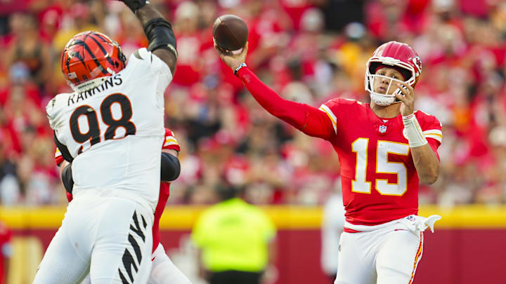 Sep 15, 2024; Kansas City, Missouri, USA; Kansas City Chiefs quarterback Patrick Mahomes (15) throws a pass against Cincinnati Bengals defensive tackle Sheldon Rankins (98) during the first half at GEHA Field at Arrowhead Stadium. Mandatory Credit: Jay Biggerstaff-Imagn Images