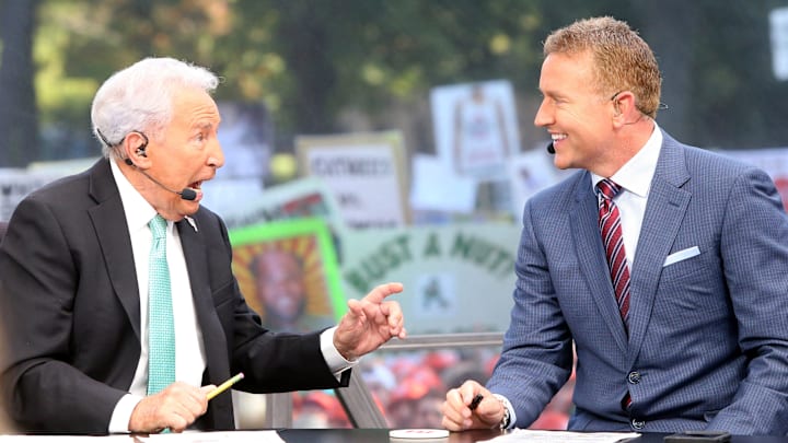 Hosts Lee Corso, at left, and Kirk Herbstreit talk during the ESPN College GameDay show on Saturday,