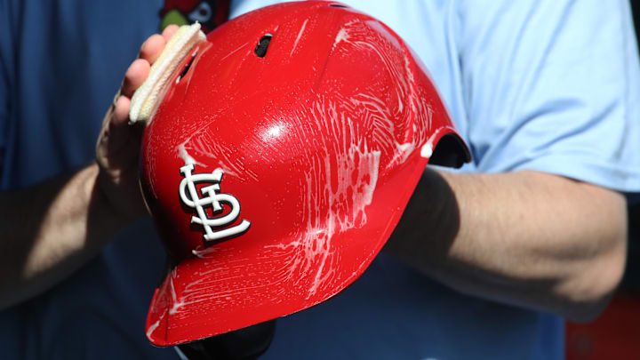 Apr 9, 2025; Pittsburgh, Pennsylvania, USA;  The St. Louis Cardinals equipment manger scrubs the team batting helmets before the game against the Pittsburgh Pirates at PNC Park. Mandatory Credit: Charles LeClaire-Imagn Images