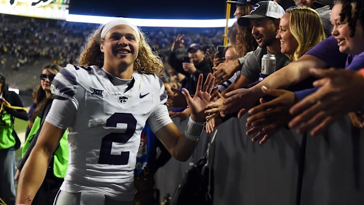 Oct 12, 2024; Boulder, Colorado, USA; Kansas State Wildcats quarterback Avery Johnson (2) celebrates with fans after a win against the Colorado Buffaloes at Folsom Field. Mandatory Credit: Christopher Hanewinckel-Imagn Images