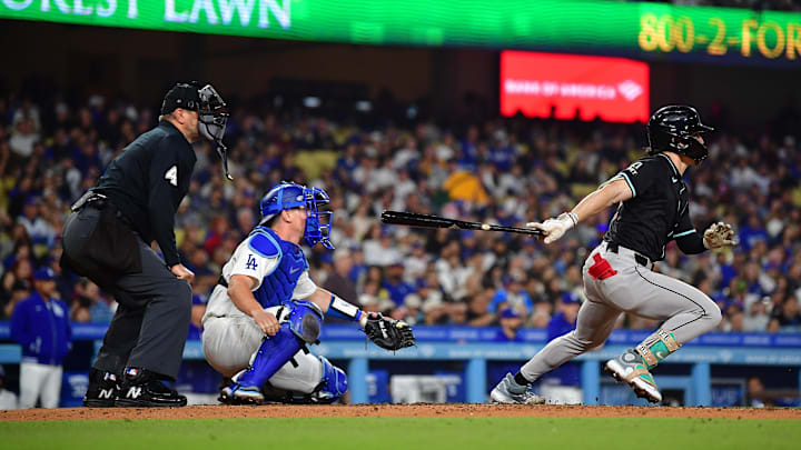 May 22, 2024; Los Angeles, California, USA; Arizona Diamondbacks center fielder Corbin Carroll (7) hits a two run RBI triple against the Los Angeles Dodgers 
