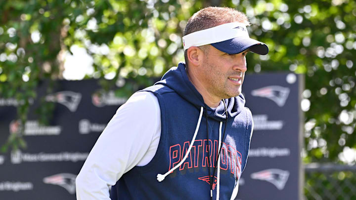 Jul 28, 2025; Foxborough, MA, USA; New England Patriots offensive coordinator Josh McDaniels heads to the practice fields for training camp at Gillette Stadium. Mandatory Credit: Eric Canha-Imagn Images