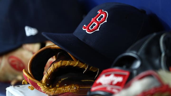 Sep 20, 2019; St. Petersburg, FL, USA; A detail view of Boston Red Sox hats and gloves at Tropicana Field. Mandatory Credit: Kim Klement-Imagn Images