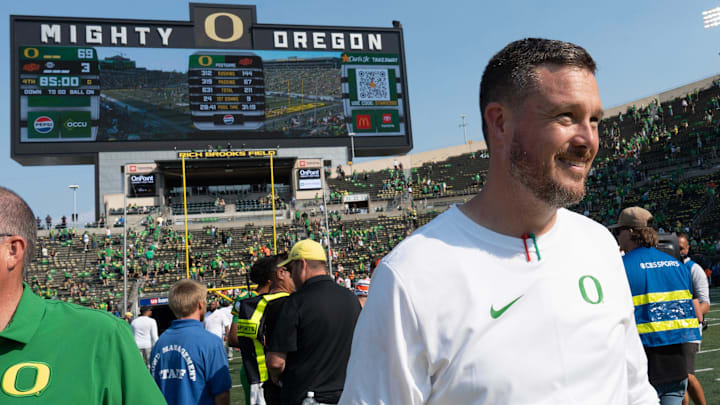 Oregon Head Coach Dan Lanning leaves the field after the win over Oklahoma State at Autzen.