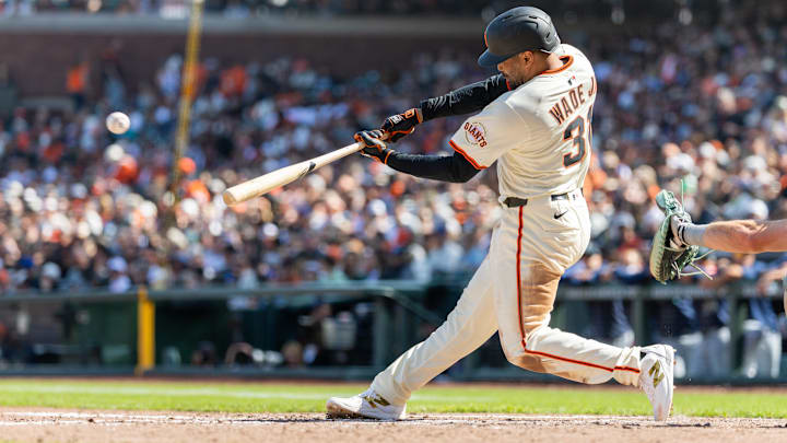 Apr 4, 2025; San Francisco, California, USA; San Francisco Giants first baseman LaMonte Wade Jr. (31) hits a triple during the fifth inning against the Seattle Mariners at Oracle Park.