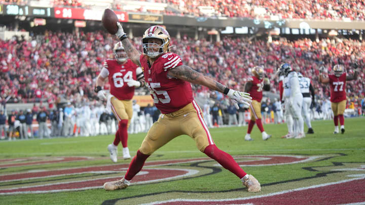 Dec 14, 2025; Santa Clara, California, USA; San Francisco 49ers tight end George Kittle (85) scores a touchdown during the third quarter against the Tennessee Titans at Levi's Stadium. Mandatory Credit: Cary Edmondson-Imagn Images Dec 14, 2025; Santa Clara, California, USA; San Francisco 49ers tight end George Kittle (85) scores a touchdown during the third quarter against the Tennessee Titans at Levi's Stadium. Mandatory Credit: Cary Edmondson-Imagn Images