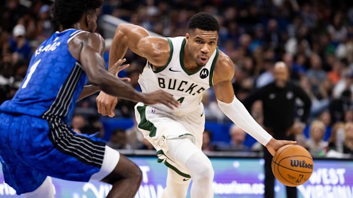 Nov 11, 2023; Orlando, Florida, USA; Milwaukee Bucks forward Giannis Antetokounmpo (34) drives to the basket against Orlando Magic forward Jonathan Isaac (1) during the second half at Amway Center. Mandatory Credit: Matt Pendleton-Imagn Images