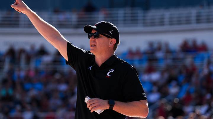 Oct 7, 2026; Mason, OH, USA; Cincinnati Bearcats head coach Jerrod Calhoun works the sideline during the game against the Ohio State Buckeyes in the second half during the 2026 CareSource Invitational at the Lindner Family Tennis Center. Mandatory Credit: Aaron Doster-Imagn Images Oct 7, 2026; Mason, OH, USA; Cincinnati Bearcats head coach Jerrod Calhoun works the sideline during the game against the Ohio State Buckeyes in the second half during the 2026 CareSource Invitational at the Lindner Family Tennis Center. Mandatory Credit: Aaron Doster-Imagn Images