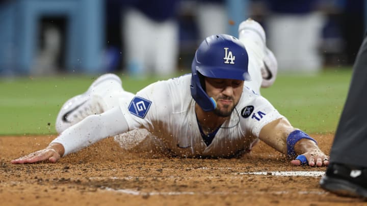 Dodgers outfielder Michael Conforto (23) scores during the sixth inning against the Athletics at Dodger Stadium on May 14.