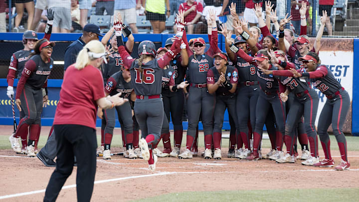 Oklahoma Sooners players celebrate Abigale Dayton's seventh inning home run in the WCWS semifinals.