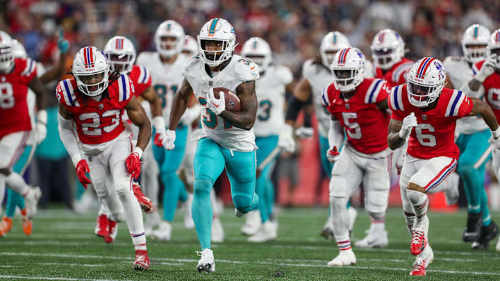 Miami Dolphins running back Raheem Mostert (31) runs the ball for a touchdown during the second half against the New England Patriots at Gillette Stadium in 2023.
