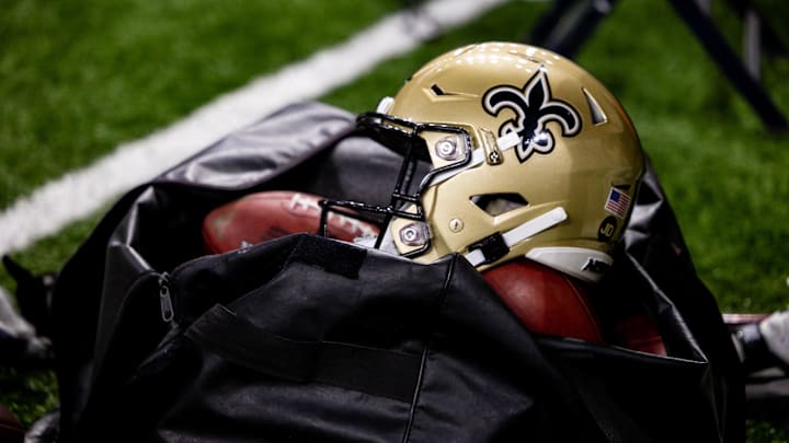 Nov 5, 2023; New Orleans, Louisiana, USA;  Detailed view of the New Orleans Saints helmet and ball bag against the Chicago Bears during the first half at the Caesars Superdome. Mandatory Credit: Stephen Lew-Imagn Images