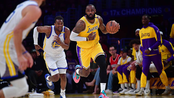 Apr 3, 2025; Los Angeles, California, USA: Los Angeles Lakers forward LeBron James (23) moves the ball up court ahead of Golden State Warriors forward Kevon Looney (5) during the first half at Crypto.com Arena. Mandatory Credit: Gary A. Vasquez-Imagn Images Apr 3, 2025; Los Angeles, California, USA: Los Angeles Lakers forward LeBron James (23) moves the ball up court ahead of Golden State Warriors forward Kevon Looney (5) during the first half at Crypto.com Arena. Mandatory Credit: Gary A. Vasquez-Imagn Images