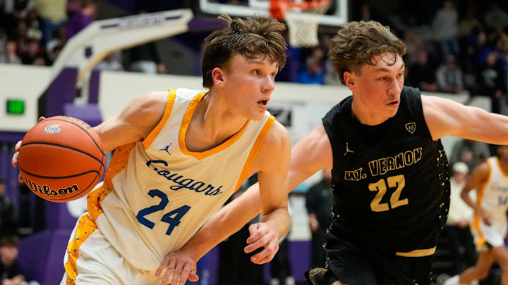 Before hitting one of the greatest shots in NCAA Tournament history, Braylon Mullins (24) was a high school basketball star at Greenfield-Central High School in Indiana.