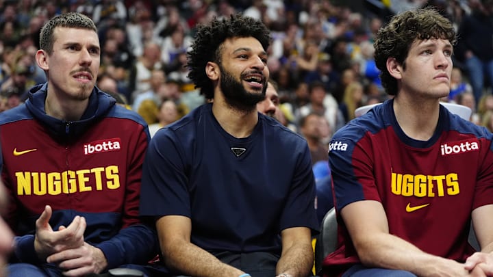 Apr 6, 2025; Denver, Colorado, USA; Denver Nuggets forward Vlatko Cancar (31), guard Jamal Murray (27) and center PJ Hall (13) on the bench during the fourth quarter against the Indiana Pacers at Ball Arena. Mandatory Credit: Ron Chenoy-Imagn Images