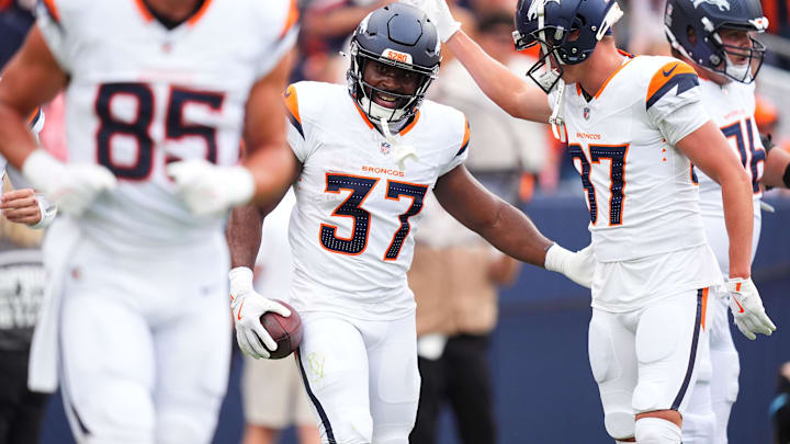Aug 25, 2024; Denver, Colorado, USA; Denver Broncos running back Audric Estime (37) celebrates his touchdown with wide receiver David Sills V (87) in the first quarter against the Arizona Cardinals at Empower Field at Mile High. Mandatory Credit: Ron Chenoy-Imagn Images Aug 25, 2024; Denver, Colorado, USA; Denver Broncos running back Audric Estime (37) celebrates his touchdown with wide receiver David Sills V (87) in the first quarter against the Arizona Cardinals at Empower Field at Mile High. Mandatory Credit: Ron Chenoy-Imagn Images