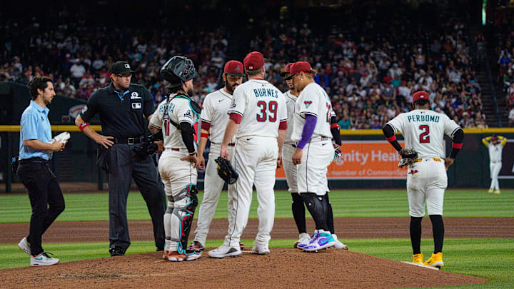 Jun 1, 2025; Phoenix, Arizona, USA; Arizona Diamondbacks starting pitcher Corbin Burnes (39) reacts after an injury in the fith inning and leaves the field against the Washington Nationals at Chase Field. Mandatory Credit: Allan Henry-Imagn Images
