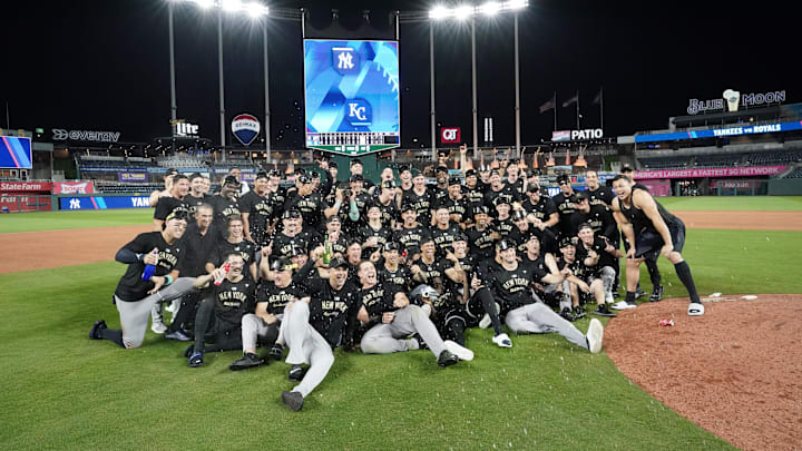 Oct 10, 2024; Kansas City, Missouri, USA; New York Yankees celebrate on the field following a win over the Kansas City Royals during game four of the ALDS for the 2024 MLB Playoffs at Kauffman Stadium. 