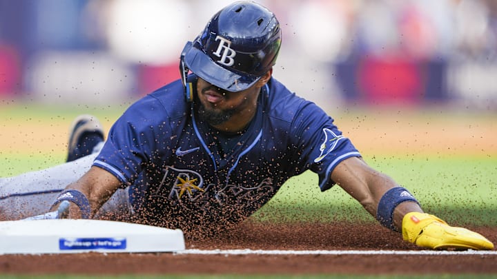 Sep 27, 2025; Toronto, Ontario, CAN; Tampa Bay Rays outfielder Chandler Simpson (14) slides into third base during the fifth inning against the Toronto Blue Jays at Rogers Centre.