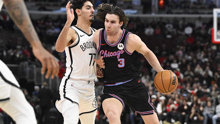 Dec 3, 2025; Chicago, Illinois, USA; Chicago Bulls guard Josh Giddey (3) drives against Brooklyn Nets guard Ben Saraf (77) during the first half at the United Center. Mandatory Credit: Matt Marton-Imagn Images Dec 3, 2025; Chicago, Illinois, USA; Chicago Bulls guard Josh Giddey (3) drives against Brooklyn Nets guard Ben Saraf (77) during the first half at the United Center. Mandatory Credit: Matt Marton-Imagn Images