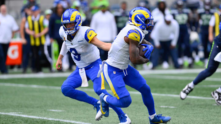 Sep 10, 2023; Seattle, Washington, USA; Los Angeles Rams quarterback Matthew Stafford (9) hands the