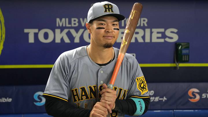 Mar 15, 2025; Bunkyo, Tokyo, Japan; Hanshin Tigers right fielder Teruaki Sato (8) poses for a photo after defeating the Chicago Cubs at Tokyo Dome. Mandatory Credit: Darren Yamashita-Imagn Images Mar 15, 2025; Bunkyo, Tokyo, Japan; Hanshin Tigers right fielder Teruaki Sato (8) poses for a photo after defeating the Chicago Cubs at Tokyo Dome. Mandatory Credit: Darren Yamashita-Imagn Images